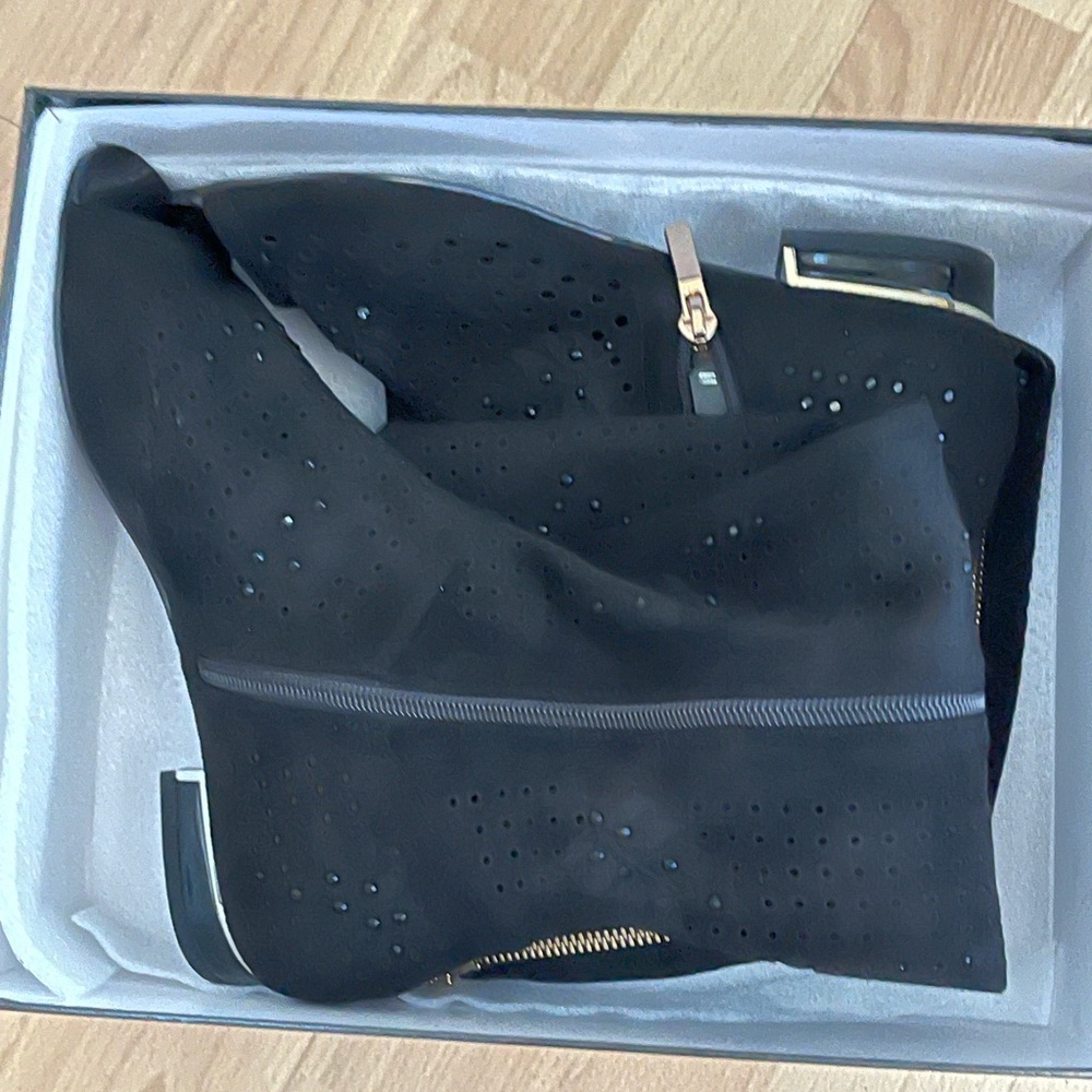 Brand new boots, newer worn suede knee high, open toe.